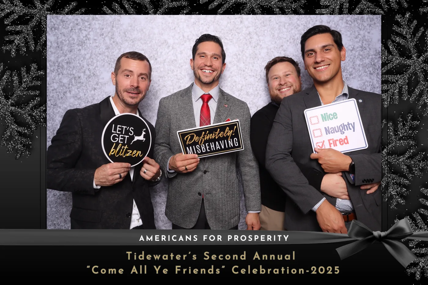 Holiday celebration photo booth with festive props at a Hampton Roads company party