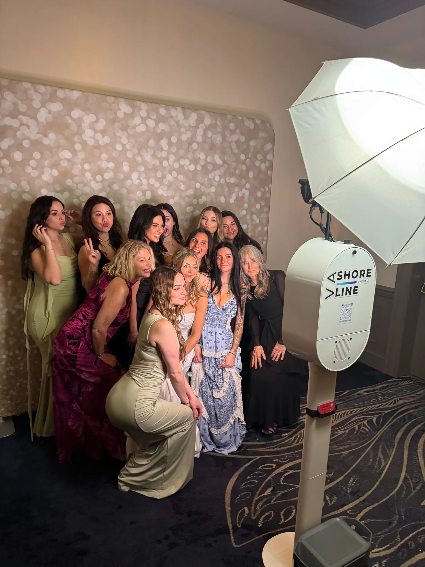 Wedding party group photo booth at Virginia Beach reception — bridesmaids and guests posing at VA Shoreline Events booth
