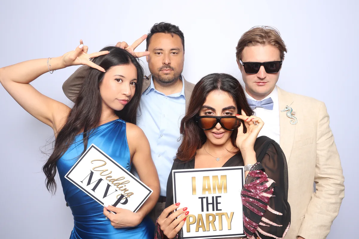 wedding guests having a blast at photo booth rental Virginia Beach