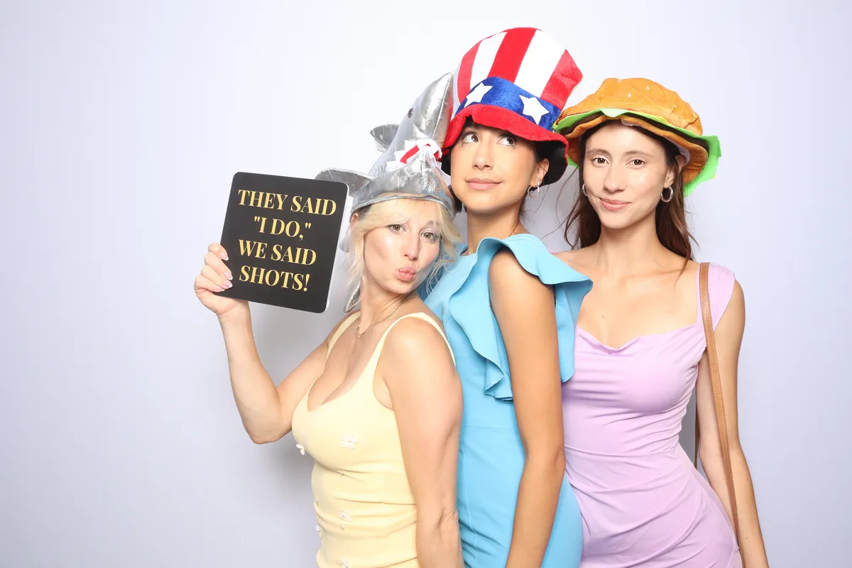 Ladies having fun at wedding photo booth Virginia Beach