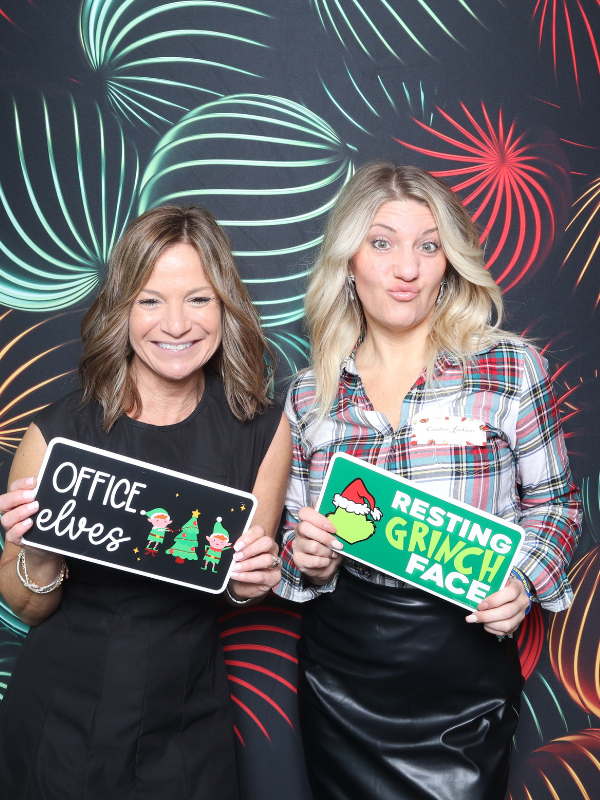 Corporate holiday party photo booth Hampton Roads — coworkers with fun props and festive backdrop