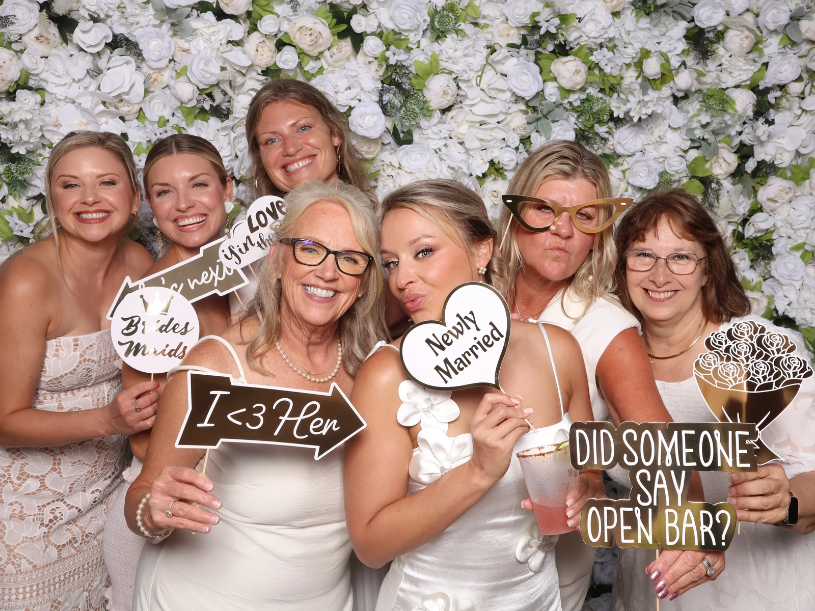 Happily Ever After wedding photo booth Virginia Beach 2025 — bridal party floral backdrop