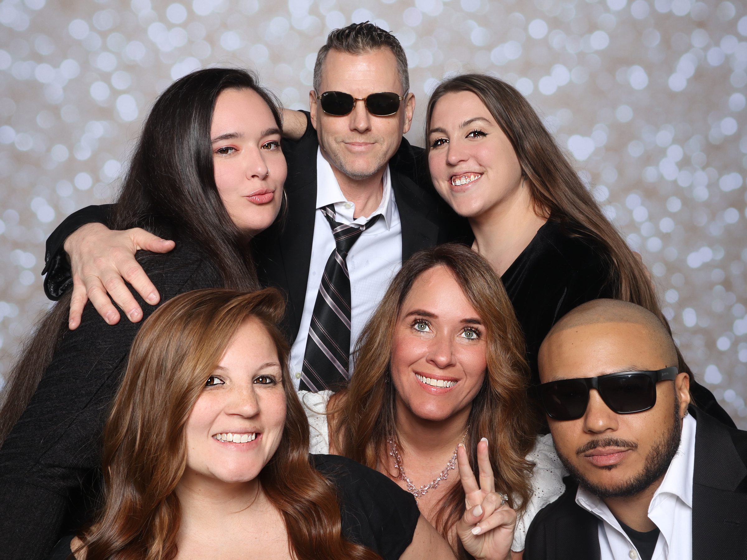 Sweet 16 party photo booth Virginia Beach 2025 — group of guests with bokeh backdrop