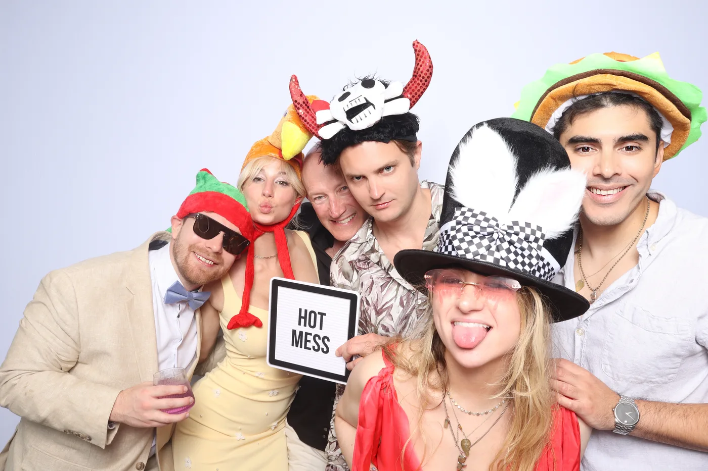 Wedding guests with fun props at Bryggies Beach photo booth Virginia Beach 2025