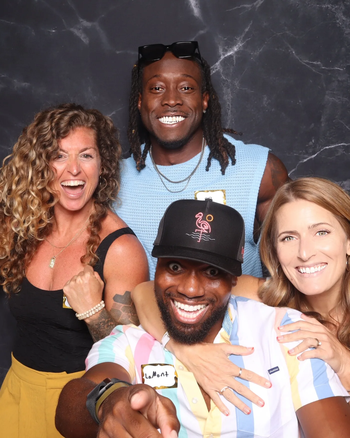 Group of friends at a marble-backdrop photo booth — Virginia Beach