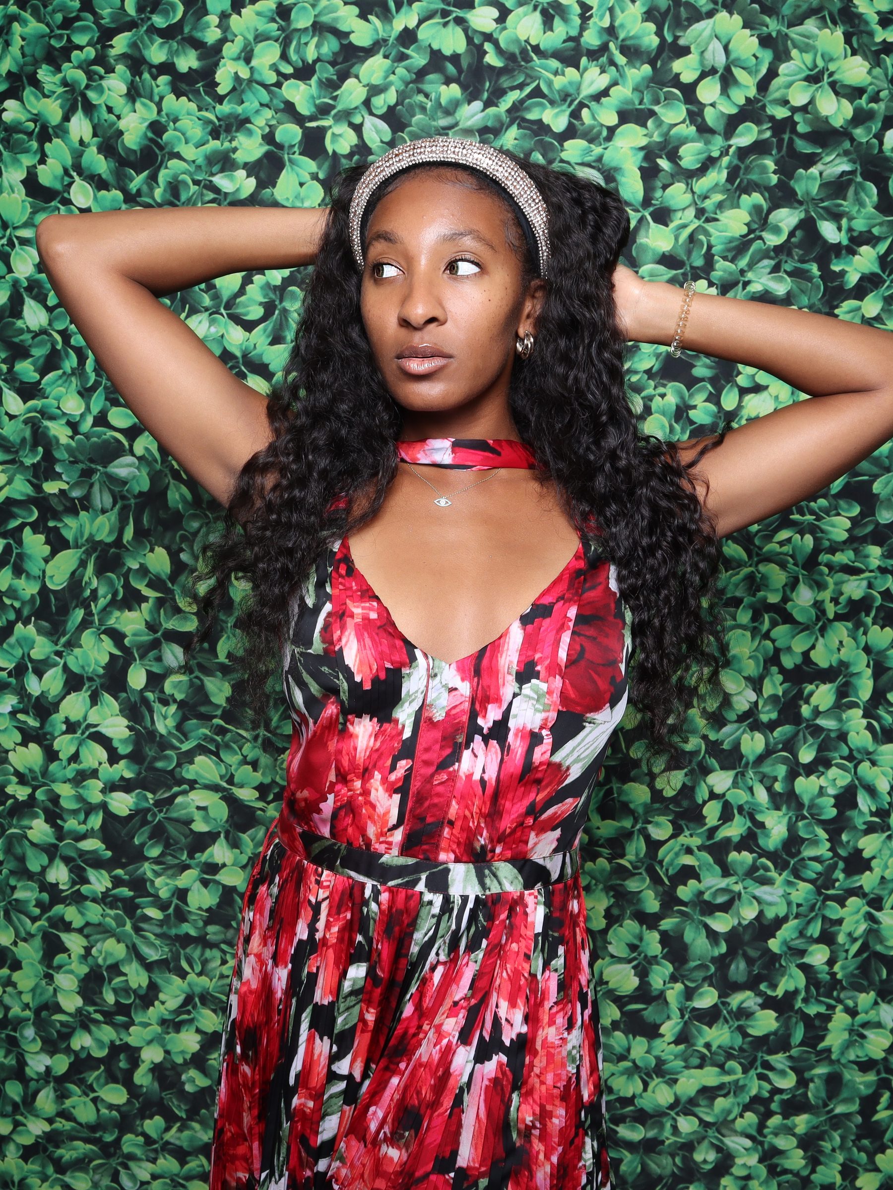 Kayla and Damian celebration photo booth Virginia Beach 2025 — guest with green leaf backdrop