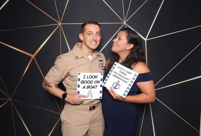 Navy sailor and spouse celebrating Chief pinning at photo booth Virginia Beach
