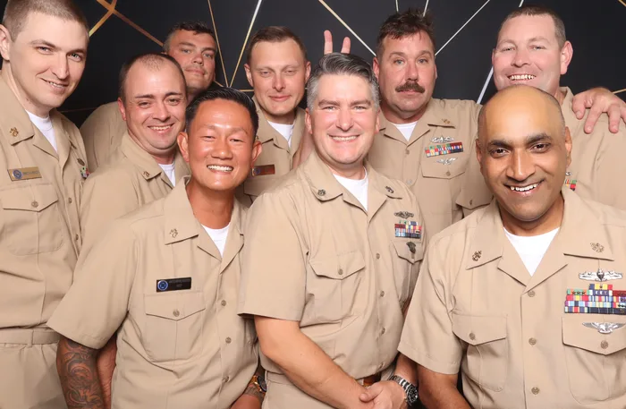 Large group photo booth picture at Norfolk Naval Shipyard event Virginia 2026