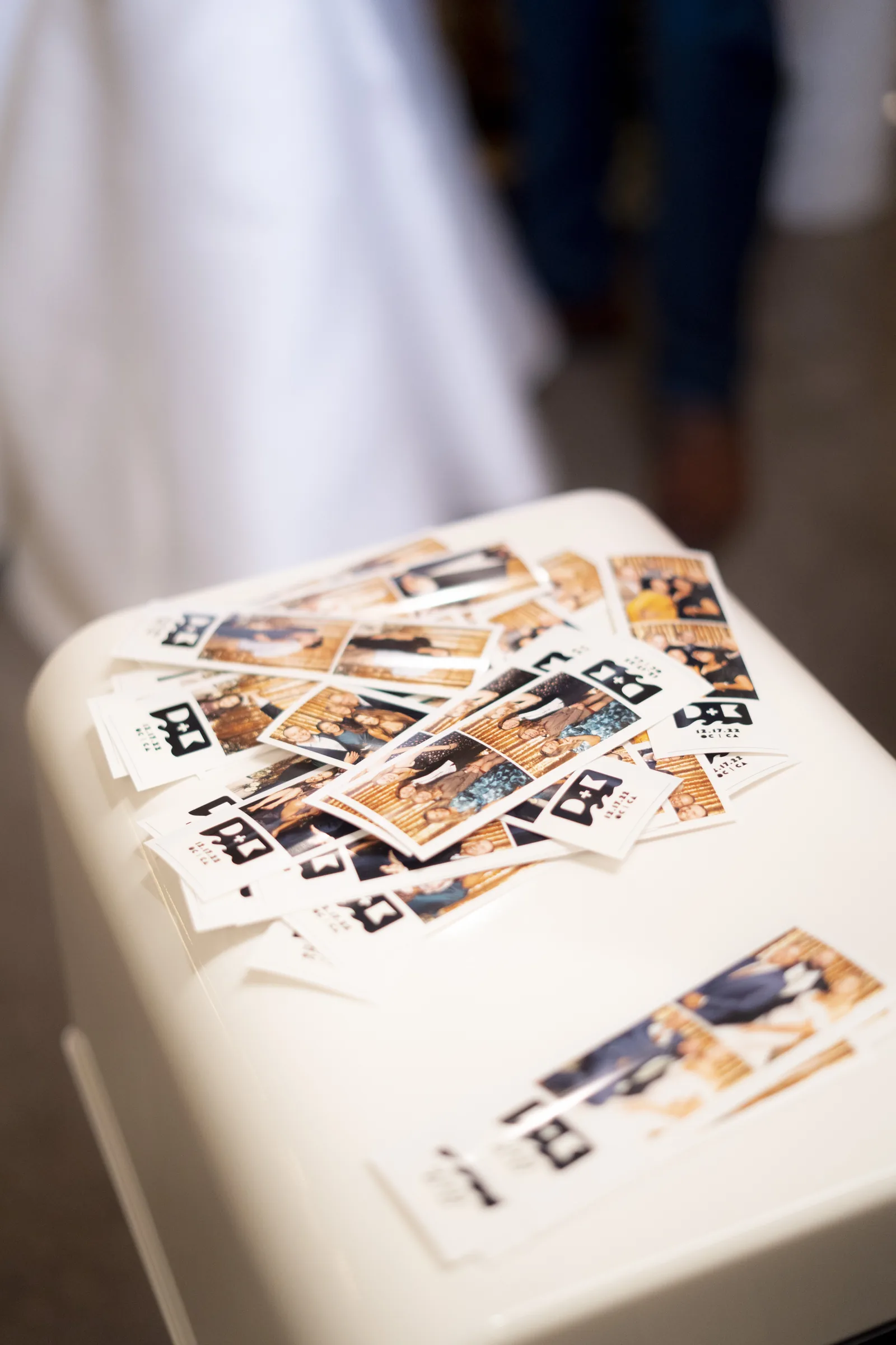 wedding photo booth rental print strips piled at Virginia Beach event